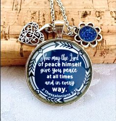 "Scripture Necklace, Christian jewelry for women, Gift for women, Bible Verse Necklace, faith jewellery This beautiful necklace have a blue background and it comes with 2 charms as in the picture. quote reads: \" Now may the Lord of peace himself give you peace at all times and in every way.\" 2 Thessalonians 3: 16   Pendant is silver colour, 30 mm in size.  the chains are: - 24 inches long, cable chain stainless steel - 30 inches long, ball chain stainless steel please do not swim or shower wit Inspirational Blue Jewelry For Gifts, Inspirational Blue Jewelry As A Gift, Spiritual Blue Jewelry For Mother's Day, Blue Personalized Inspirational Jewelry, 2 Thessalonians 3 16, Christian Jewelry For Women, Verse Necklace, Bible Verse Necklace, 2 Thessalonians