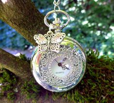 This lovely silver tone pendant watch necklace reminds in style of past times, like Art Nouveau and Victorian jewelry and features a large butterfly charm in bright silver or handpainted in black silver.  This pocketwatch will make a sweet and beloved gift for women who love nostalgic jewelry, and is also a beautiful gift for bridesmaids, and an heirloom to keep, for Christmas, New Year, Valentines Day, Birthday, Wedding, Easter... More styles here: https://annaleasfinest.etsy.com This romantic Luxury Silver Pocket Watch For Formal Occasions, Vintage Silver Pocket Watch For Wedding, Silver Vintage Pocket Watch, Silver Vintage Pocket Watch Gift, Vintage Silver Pocket Watch As Gift, Vintage Silver Pocket Watch For Gift, Silver Engraved Pocket Watch As Gift, Engraved Silver Pocket Watch As Gift, Engraved Silver Pocket Watch For Gift