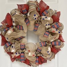 a patriotic wreath hanging on the front door