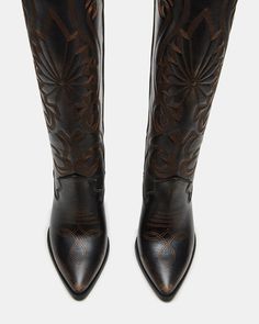 A Western boot is a requirement for any wardrobe and we’re obsessed with LASSO. This knee-high pair features whipstitching detail and a towering block heel. 3.75 inch heel height Size 6 measurements: 17 inch shaft circumference, 13.5 inch shaft height Size 8 measurements: 18 inch shaft circumference, 14.25 inch shaft height Size 10 measurements: 19 inch shaft circumference, 15 inch shaft height Leather upper material Textile and synthetic lining Synthetic sock Synthetic sole Imported Snake Skin Boots, Western Boots Women, Western Boot, Wide Calf, Spring Tops, Spring Looks, Sweaters Knitwear, Tank Top Cami, Fun Bags