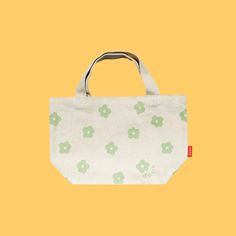 Flower Power Mini Tote Bag – shopdous Spring Green Canvas Bag, Green Canvas Bag For Spring, Green Flower-shaped Bag For Spring, Green Flower-shaped Everyday Bags, Cotton Flower-shaped Bag For Daily Use, Green Canvas Bag For Daily Use In Spring, Rectangular Canvas Bag With Floral Print, Floral Print Rectangular Canvas Bag, Green Eco-friendly Tote Canvas Bag