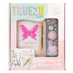 a pink box with a butterfly and writing set in it's packaging, including a pen