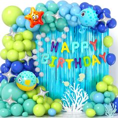 an ocean themed birthday party with balloons and streamers