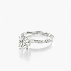 a diamond engagement ring on a white background