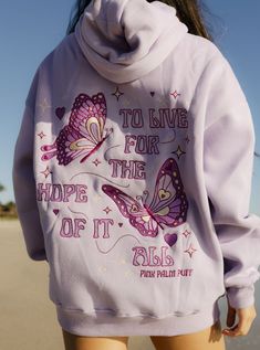 The "To Live For the Hope of it All" Oversized Hoodie is crafted from top-quality fabrics, while having an exquisite embroidery art of fine-detailed butterflies. The PPP palm embroidered above our hearts is a symbol of unity within the Pink Palm Puff community, reminding us all of the love we share. Pink Palm Puff Hoodie Purple, Hoodie Collection Aesthetic, Hoodie Wishlist, Preppy Sweatshirts, Inspiring Message, Classic American Style, Cozy Fabric, The Hope, Bright Side