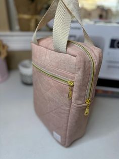 This beautiful Bible bag is made with soft, quilted fabric in a beautiful blush pink canvas, offering both charm and durability. It's designed to fit Bibles measuring up to 6.5" H x 2" W x 9" L, keeping your Bible safe and secure. The front zipper pocket provides easy access to small items, while the back snap pocket offers extra storage for notes or accessories. Perfect for anyone who values both style and function, this Bible bag makes carrying your Bible convenient and fashionable. (Bible not included.) Note: Please check your Bible's dimensions. For larger Bibles or additional space, I offer custom-sized bags through a separate listing. Blush Bag With Zipper For Everyday Use, Blush Rectangular Shoulder Bag With Zipper, Pink Quilted Shoulder Bag For Daily Use, Everyday Pink Quilted Shoulder Bag, Blush Rectangular Bag With Zipper Closure, Pink Quilted Rectangular Shoulder Bag, Pink Quilted Pouch Bag, Pink Quilted Bag For On-the-go, Quilted Pink Bag For On-the-go