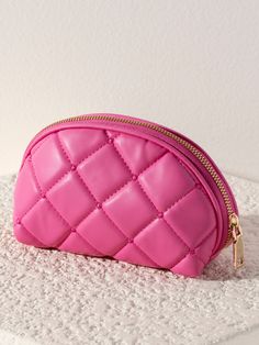 Say “Bonjour!” to your new favorite accessory, Shiraleah’s Mademoiselle Zip Pouch. Made from trendy quilted PU in a vibrant pink color, this compact, crescent-shaped cosmetic bag is ideal to carry all your odds and ends in style. The Mademoiselle Zip Pouch is made in the same style as the Mademoiselle Wristlet, Card Case, and Camera Bag which can be combined to form one magnifique collection. Pair with other items from Shiraleah to complete your look! Shiraleah is a trend-driven lifestyle brand Pink Quilted Pouch Bag, Pink Portable Cosmetic Bag, Compact Pink Cosmetic Bag, Chic Pink Pouch With Zipper Closure, Chic Pink Cosmetic Bag With Removable Pouch, Trendy Pink Clutch Cosmetic Bag, Pink Clutch Cosmetic Bag With Zipper, Chic Pink Clutch Cosmetic Bag, Chic Pink Compact Bag