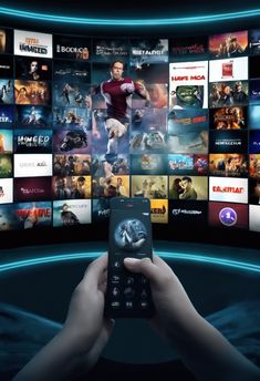 a person holding a remote control in front of a television screen with many movies on it