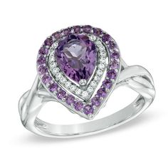 On her February birthday, express your affection with this exquisite amethyst and diamond fashion ring. Expertly crafted in sleek sterling silver, the eye is drawn to the 8.0 x 6.0mm pear-shaped bright purple amethyst center stone. A double border of shimmering round accent diamonds and glistening round amethyst accents surrounds the center stone. The ring's cleverly twisting shank completes the design. A look she'll treasure, this ring captivates with 1/10 ct. t.w. of diamonds and a polished sh Purple Diamond Ring With Gemstone Accents, Elegant Purple Diamond Ring With Gemstone Accents, Fine Jewelry Purple Diamond Ring With Gemstone Accents, Purple Birthstone Ring With Gemstone Accents, Purple Diamond Ring With Birthstone, Purple Diamond Ring With Diamond Accents For Anniversary, Purple Diamond Ring With Accents For Anniversary, Fine Jewelry Purple Rings With Diamond Accents, White Gold Diamond Birthstone Ring With Gemstone Accents