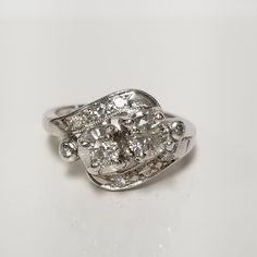 "Thanks for shopping our vintage estate store. We tend to sell well below wholesale and truly hope you enjoy all of our items. Many of the items are one of a kind, so please enjoy scrolling through the pictures and hopefully something will catch your eye. Brown spots are from camera or reflections. Beautiful estate 14k White Gold round .75ct diamond vintage cocktail ring from the 1930's. The center diamond is flawless and .50ct, next to it is .15ct old mine cut, or more and there are 8 single cut diamonds in the setting. Retails $4,399 on sale $1499 Ring size: 6 Setting: 12.5mm 1/2\" Band width: 2mm Weight: 4.37 grams Clarity: SI1/2 Color: F/G Beautiful filigree ring and the diamond is amazing. Marked 14k." Vintage Cocktail Ring, Custom Ring, Vintage Cocktail, Brown Spots, Filigree Ring, Vintage Diamond, Cocktail Ring, Cocktail Rings, Custom Rings