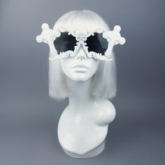 Hand-decorated white filigree ornate sunglasses. Decorated with hand moulded filigree, skull & crosses. They are UV400 & unisex. You can get these sunglasses in different coloured filigree! Currently my list is: Black White Red Silver (£5 extra) Gold (£5 extra) Yellow Orange Green Pink Pastel Pink Blue Pastel Blue HOWEVER most of my sunglasses base is red, white or black at this time. Just message me BEFORE the checkout to ask if i can change the colour! The filigree sunglasses are made White Festival Sunglasses For Summer, White Sunglasses For Summer Festival, Summer Festival White Sunglasses, White Tinted Festival Sunglasses, Elegant White Plastic Sunglasses, Vintage White Party Sunglasses, Skull Filigree, Sunglasses Decorated, Dark Beauty Magazine