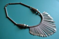 "LARGE vintage 1990s India handmade silvercolor metal statement necklace choker.  Size:   18.5 \"/ inch or 47 cm.  Hanging metal parts 4 \"/ inch or 10 cm wide and graduated in length from 1.2 - 2.75 \"/ inch or 3 - 7 cm.  Exellent condition." Retro Silver Metal Necklaces, Retro Silver Metal Necklace, Handmade Silver Retro Choker, Handmade Retro Silver Choker, Retro Adjustable Silver Necklace, Silver Costume Jewelry Choker, Festival Silver Metal Choker, Vintage Sterling Silver Choker In Silver, Vintage Metal Choker Nickel-free