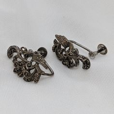 I present for sale a nice pair of Vintage Solid Sterling Silver Marcasite Flower Pattern Ladies Earrings Screw-Backs. Size of drop earrings is 23mm x 13mm overall; screw-back closure. Earrings are in excellent condition, and have all their marcasites, and are still in their original box. Accuracy in description; I sell only real jewellery! Solid gold or solid silver & I describe the stones properly! Please provide positive feedback if you are happy with your item and the service I provide. If yo Ornate Formal Earrings With Lever Back, Victorian Silver Earrings With Screw Back, Silver Victorian Earrings With Screw Back, Silver Victorian Screw Back Earrings, Victorian Style Silver Screw Back Earrings, Silver Screw Back Earrings, Silver Screw Back Earrings For Anniversary, If You Are Happy, Sterling Silver Marcasite