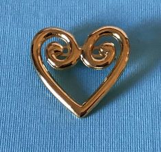 Vintage gold tone heart brooch                              020920Pin is in good condition. Please see pictures for exact condition and sizeIt comes from a clean, smoke free home.I ship quickly and offer free domestic shipping to the United States.**Buyers in the United Kingdom, please be aware that if you spend over 15 GBP, there are custom charges and handling charges from Royal Mail.Thanks for looking Please read our return policy before purchasing. We package well and ship quickly! Gold Brooches For Valentine's Day, Gold Brooches For Valentine's Day Formal, Gold Brooches For Formal Valentine's Day, Gold Heart-shaped Brooches For Gifts, Gold Heart Brooches For Wedding, Vintage Gold Heart Brooches, Heart-shaped Gold Pins For Gifts, Gold Heart-shaped Brooch For Formal Occasions, Gold Heart Brooch For Formal Occasions