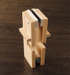 a wooden object sitting on top of a table