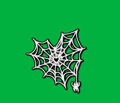 a spider web on a green background with the word halloween written in white across it