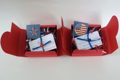 two red boxes with blue and white items in them