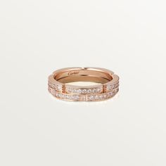 a rose gold ring with three rows of diamonds