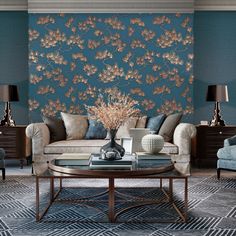 a living room filled with furniture next to a wall covered in blue and orange flowers