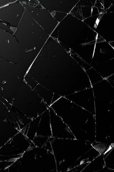 the shattered glass is black and white with some light on it's side,