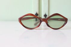 "1970s RARE Deadstock Sunglasses Wonderful vintage condition Very rare deadstock Tinted Lens as seen in picture non-prescription amazing style true vintage 5.75\"total width 2.5\"lens width 5.75\"arms length Thank YOU and please feel free to ask me any ?s:) Have a lovely day xoxo www.etsy.com/shop/retroandme #SUNDAY" Vintage Brown Cat Eye Sunglasses With Uv Protection, Vintage Brown Cat Eye Sunglasses With Polarized Lenses, Vintage Brown Cat Eye Sunglasses With Gradient Lenses, Retro Brown Cat Eye Sunglasses With Uv Protection, Retro Brown Cat Eye Sunglasses With Mirrored Lenses, Vintage Brown Cat Eye Sunglasses For Summer, Vintage Brown Sunglasses With Mirrored Lenses, Retro Brown Cat Eye Sunglasses With Gradient Lenses, Vintage Brown Cat Eye Sunglasses