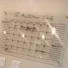 a calendar hanging on the wall in a bathroom