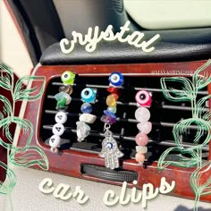 a car dashboard with an assortment of glass beads and charms on the front of it