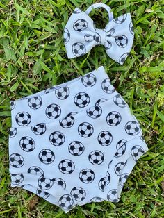 ⚽️Soccer Moms this is such an  adorable ⚽️ bummie and bow set. This little ⚽️ set will take eyes off the ball and onto your little one. Perfect for girl or boy. It is made of the soft, stretchy, comfy knit that feels good and looks great. The size of the soccer balls may vary slightly due to the availability from our supplier but it should not change the over all look of the bummie. If you would like this made in a skirted bummie just message me. I love custom orders.  Adult supervision is recommended while wearing our items due to some have small parts. If you would like something made special just for you message me and we will create something you will love. Turn around time is 7-14 business days but should you need your order sooner just message me. Made in the USA White Playful Bloomers For Playtime, Playful White Diaper Cover For Playwear, Playful White Bloomers For Playtime, White Casual Diaper Cover For Playwear, Casual White Diaper Cover For Playwear, Cute Short Diaper Cover For Playtime, Soccer Girls Outfits, Soccer Moms, Soccer Baby