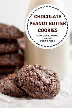 chocolate peanut butter cookies are stacked on top of each other with a bottle of milk in the background