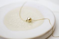 "Minimalistic, classy and elegant! This necklace is perfect for any occasion. Shinny Beads in sterling silver or gold filled. A perfectly Shinny ball bead pendants threated on a delicate feminine 14K gold filled chain. Simple and dainty gold ball necklace, featuring 14K gold filled ball and chain /Sterling silver ball and chain. ■ Turn this necklace also a Back necklace! Check out our clip on Back Necklace Chain : https://www.etsy.com/listing/250871895/mini-bead-back-necklace-dainty-beck-drop?re Elegant Ball Chain Necklace For Formal Occasions, Elegant Formal Necklace With Ball Chain, Elegant Formal Ball Chain Necklace, Elegant Ball Chain Necklace As Gift, Elegant Ball Chain Necklace For Gift, Minimalist Round Bead Necklaces For Gifts, Dainty Ball Chain Necklace For Gift, Dainty Ball Chain Necklaces As Gifts, Elegant Jewelry With Ball Chain And Round Pendant