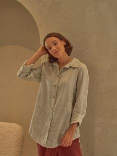 Made with a subtle stripes pattern, this linen shirt is breathable, comfortable and stylish in one. Let everyone's focus be on you - style the shirts with contrasting bottoms! Details: - 100% Linen - Strippy pattern - Collar neck - Buttons closure - Long sleeves - Relaxed fit - Hips length - Model's height is 160 cm / 5'3'' wears size M - Code: E5017-L270 The shirt is available in other colors. You can find them in the gallery. If you want to order the shirt in another color, please specify it in the personalization field. Sizing: This garment is true to size, and we recommend choosing the size you usually wear. If you want the garment to be loose-fitting, choose a larger size than you usually wear. To ensure the perfect fit we provide exact measurements of the item. Please note that we me Spring Shirt In Flax Color And Material, Spring Relaxed Fit Ramie Shirt, Spring Relax Fit Ramie Shirt, Spring Flax Shirt, Spring Button-up Flax Tops, Summer Linen Shirt In Neutral Color, Casual Long Sleeve Flax Shirt, Summer Neutral Linen Shirt, Neutral Linen Summer Shirt