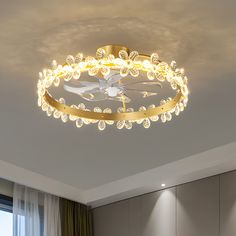 a modern ceiling light in the middle of a room