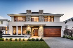 a modern house with stone and wood accents