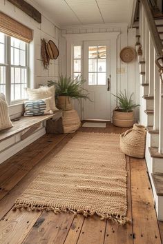 a room with wooden floors, white walls and wood trimmings on the floor