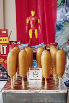 hotdogs and buns are on display at an avengers birthday party