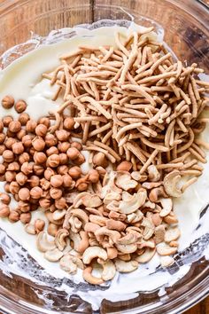 nuts and milk are mixed together in a bowl