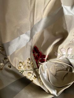 A beautiful Designer 100% Silk Taffeta in an ivory grey hue with small burgundy floral Embroidery motifs in rows across the face of the fabric. Can be used for drapery, upholstery, interior decorating, or coat and skirts garments. Sold by the yard. 54” wide. Ivory beige with burgundy floral motif. Will combine shipping. Horizontal Pattern Repeat: 10 inches Vertical Pattern Repeat: 7.5 inches Check out more of our designer and runway fabrics by visiting our store! Velvet, Silk, Linen, Cotton, Fin Elegant Beige Embroidered Fabric For Festive Occasions, Elegant Tonal Embroidered Fabric For Wedding, Elegant Embroidered Fabric For Wedding With Tonal Embroidery, Elegant Wedding Fabric With Tonal Embroidery, Elegant Embroidered Fabric For Wedding, Elegant Beige Embroidered Fabric For Formal Occasion, Elegant Embroidered Beige Fabric, Cream Embroidered Fabric For Festive Formal Occasions, Elegant Beige Floral Embroidered Fabric