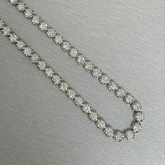 A classic and elegant everyday or occasional wear the Beauvince Adjustable Length Cupcake Tennis Necklace is a timeless and versatile piece of jewelry. It can we worn at any length between 13 inches 30 inches ranging from a choker to a long layer. Total Diamond Weight: 7.18 ct Diamond Color: G - H Diamond Clarity: SI - I (Slightly Included - Included) Metal: 14K White GoldMetal Weight: 18.35 gms Setting: Prong Set Length: 13 - 30 inches Long Layer, Diamond Free, Tennis Necklace, Diamond Settings, Long Layers, Diamond Color, Diamond Clarity, We Wear, Prong Setting