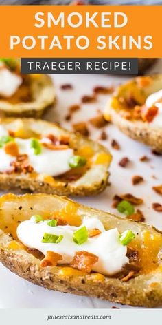 baked potato skins with sour cream and green onions on top, sitting on a white plate