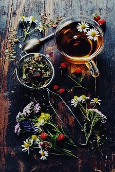 tea and flowers on a wooden table