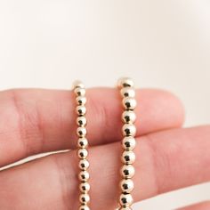 Our Stretch Bead Bracelet is the perfect balance between simple and bold. This bracelet is so versatile, so you can wear it casually lounging at home or dress it up and wear it to a fancy dinner party! Since it's a stretch bracelet, it's so comfortable that you'll never want to take it off (and you won't have to!). DETAILS 14k gold filled -or- sterling silver beads Bracelet length: 6.5". Please measure your wrist to see if this will fit, as we only have one size. It can stretch up to 6.75" comfo Everyday Stretch Bracelet With Spacer Beads, Everyday Beaded Bracelets With Spacer Beads, Minimalist Hypoallergenic Round Bead Bracelets, Adjustable Everyday Bracelets With Spacer Beads, Adjustable Everyday Bracelet With Spacer Beads, Adjustable Spacer Beads Bracelet For Everyday, Minimalist Stackable Bracelets With Round Beads, Flexible Stretch Bracelet With Spacer Beads As Gift, Minimalist Hand-strung Stretch Bracelet For Everyday