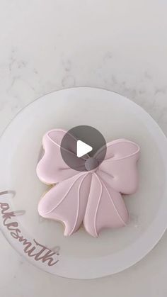 there is a decorated cookie on the plate