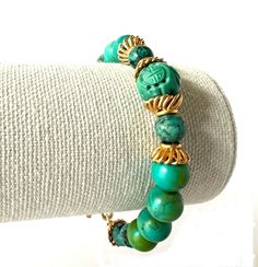 Handcrafted and One of a Kind Beaded Turquoise Bracelet features a  Vintage Chinese Carved Bead. Gold Plated Vermeil and Turquoise make a beautiful combination.   A Large Gold Vermeil Hook clasp finishes the design.  There are other bracelets that coordinate beautifully with this listing, as shown in the last photo. Make a real statement on your wrist by stacking!   Specifics: ✥ Measures 8.25" Long ✥ Includes Gift Packaging In a world of mass production, Kálon Style specializes in meticulously d Stone Bead Bracelets, Unique Beaded Bracelet, Turquoise Bead Bracelet, Mass Production, Bead Bracelets, Hook Clasp, Statement Bracelet, Green Turquoise, White Stone