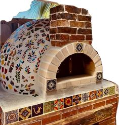 an outdoor pizza oven with colorful tiles on it