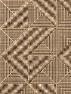 a brown and white wallpaper with an abstract design