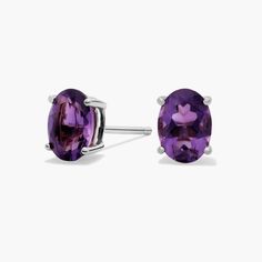 Pop on a pair of these classic oval cut amethyst stud earrings to add color to any outfit. With handcrafted 14k gold settings, these oval amethyst studs are as durable as they are stylish. Purple Oval Fine Jewelry Earrings, Classic Oval Amethyst Jewelry, Classic Oval Shaped Amethyst Jewelry, Classic Amethyst Oval Jewelry, Classic Oval Purple Jewelry, Amethyst Studs, Precious Gemstones Jewelry, Purple Earrings, Semi Precious Gemstones