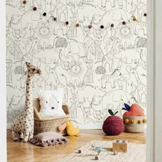 an animal themed wallpaper in a child's room with toys on the floor