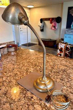 a desk lamp sitting on top of a kitchen counter