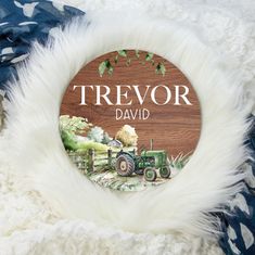 a wooden sign that says,'treovr david'with an image of a tractor