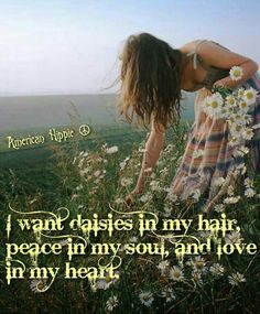 a woman kneeling down on top of a field with daisies in her hair and the words i want daisies in my hair, peace in my soul and love in my heart